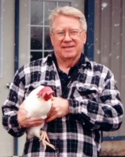 Bob Bailey training a chicken outdoors in the snow