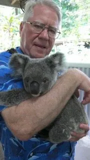 Bob Bailey holding a koala in Australia