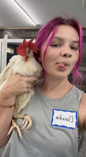 Claudia holding a chicken at a workshop